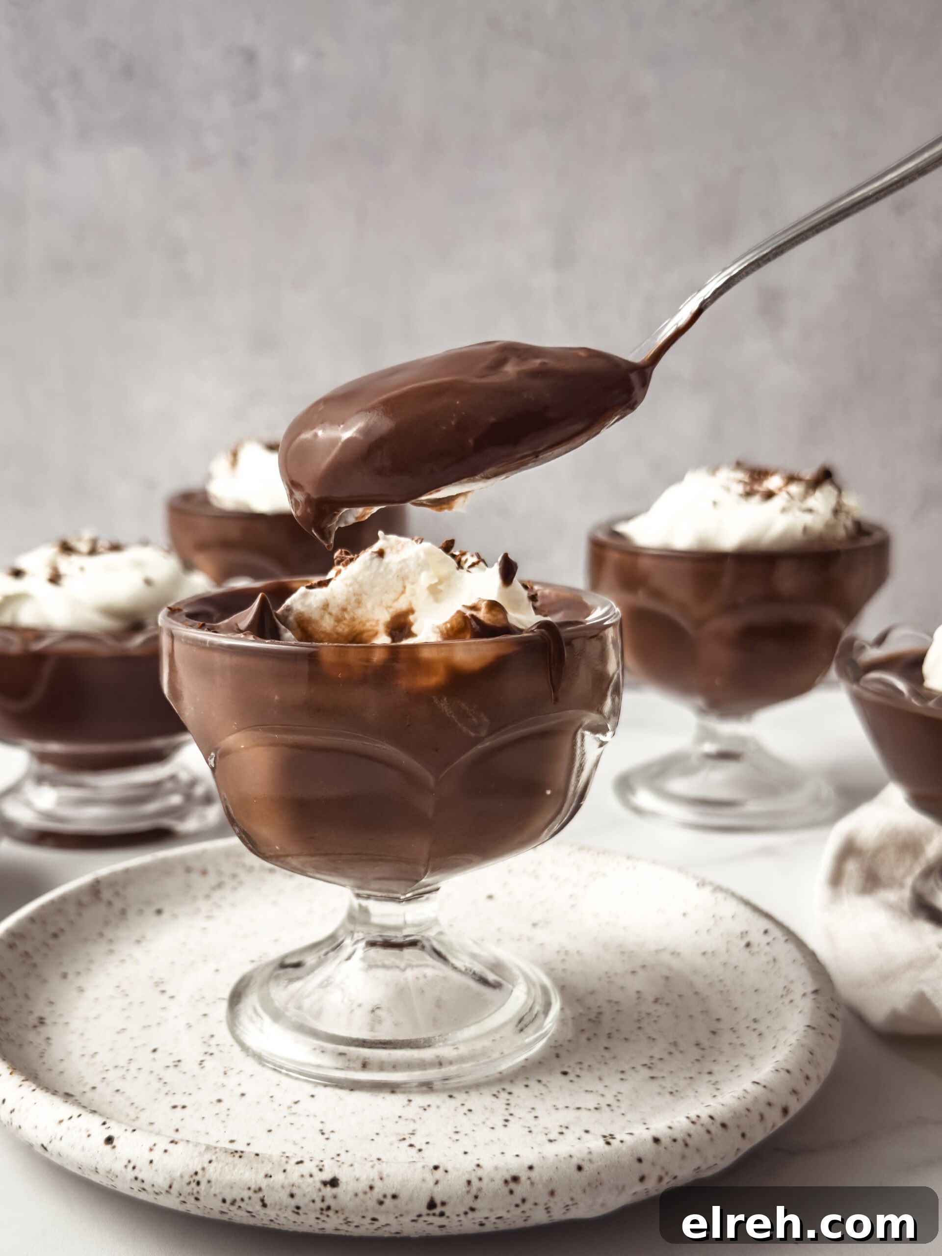 Creamy Homemade Chocolate Pudding Recipe 9 Chocolate pudding topped with whipped cream and chocolate shavings