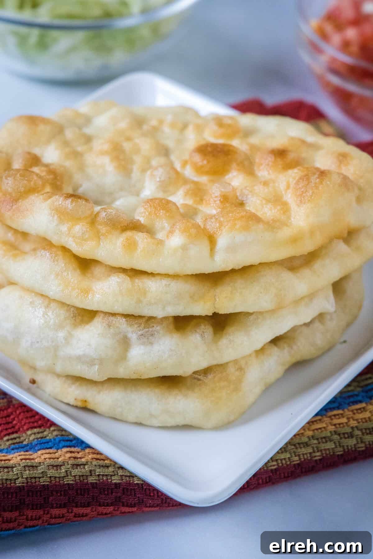 stacked indian fry bread on a plate