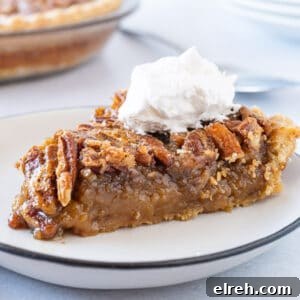 Old Fashioned Pecan Pie Recipe 15 slice of pecan pie on plate with whipped cream featured image