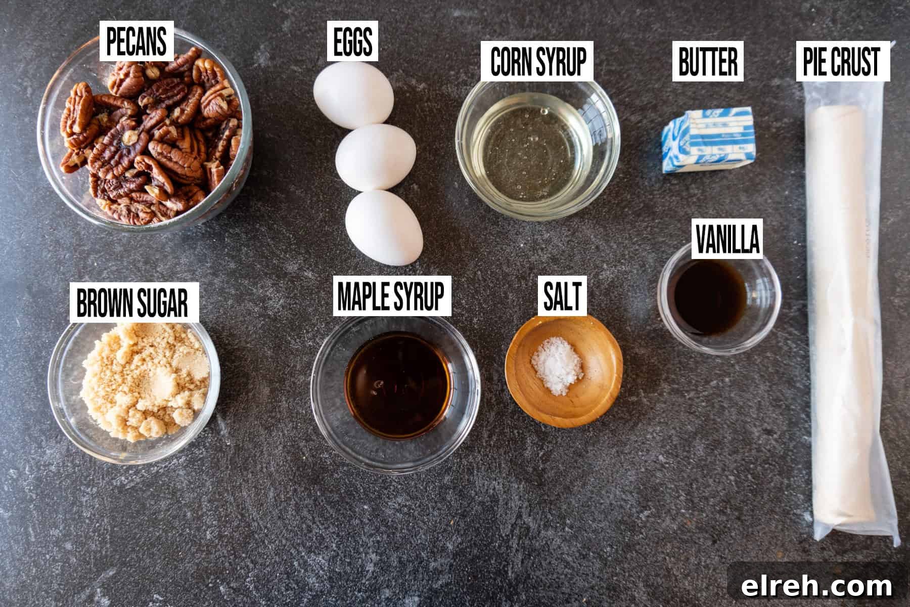 Old Fashioned Pecan Pie Recipe 4 Pecan Pie ingredients laid out and in individual bowls and labeled.