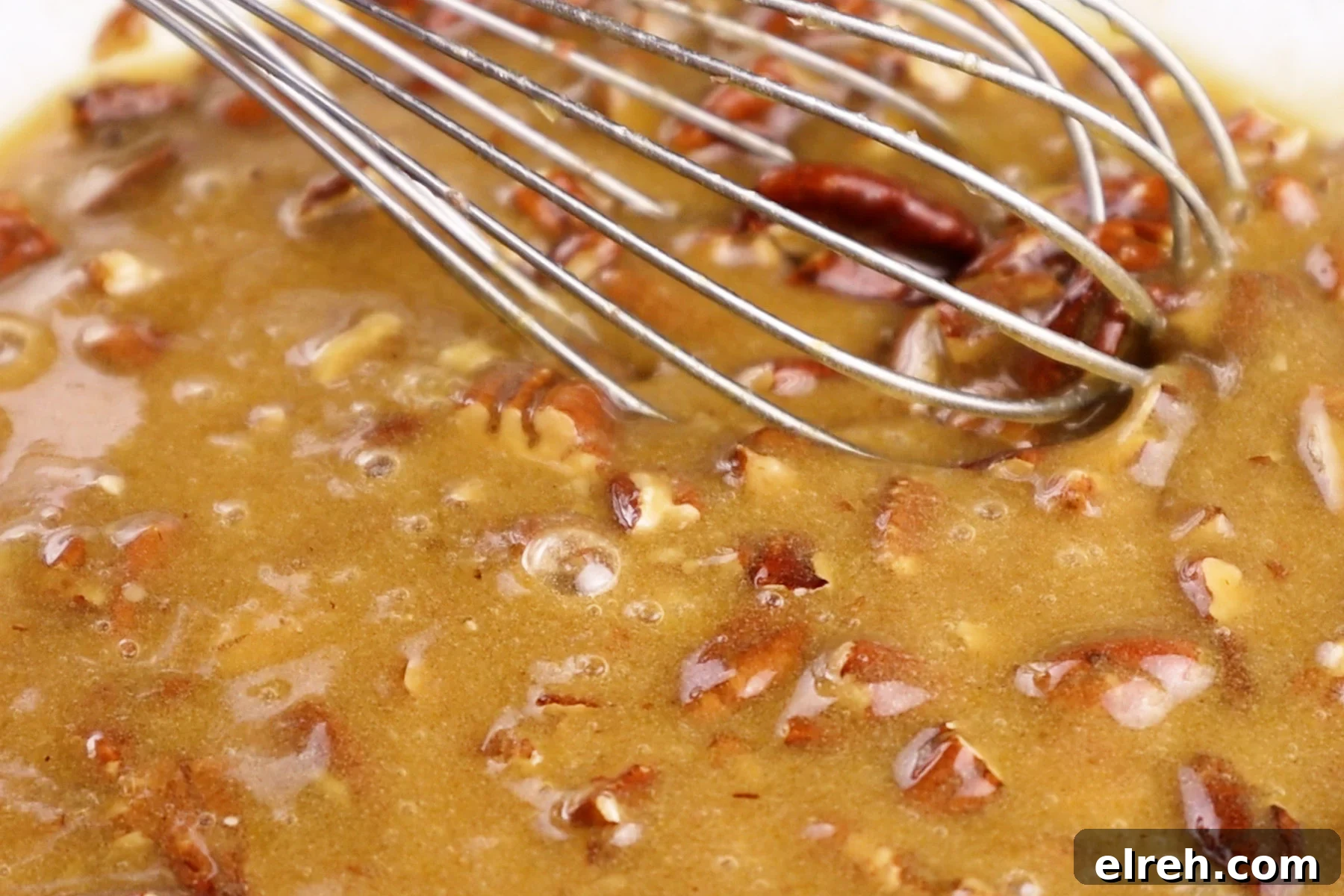 Old Fashioned Pecan Pie Recipe 7 whisking pecans into the pie filling.