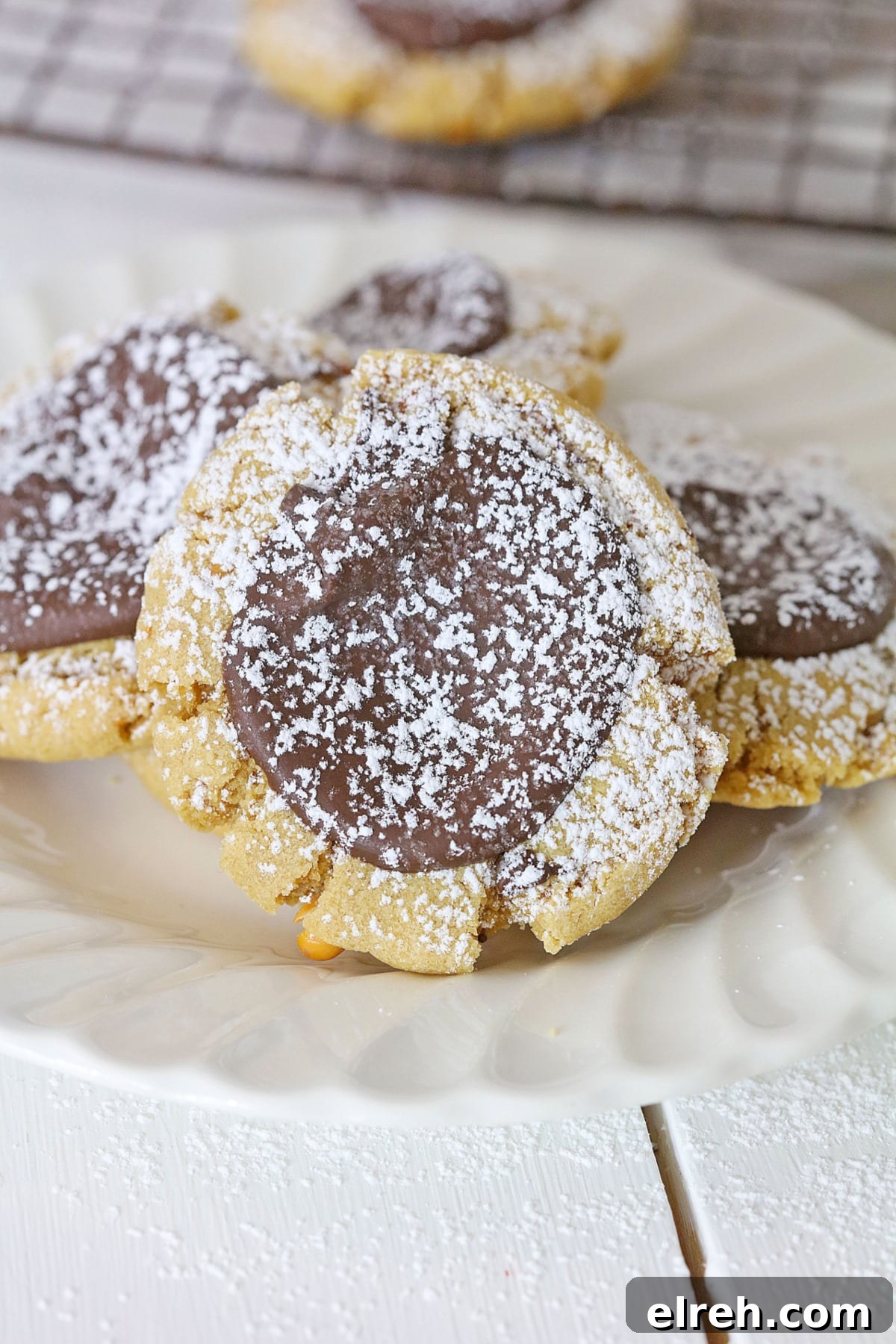Muddy Buddy Cookies: Chocolate Peanut Butter Crunch 2 four muddy buddy cookies on a plate.