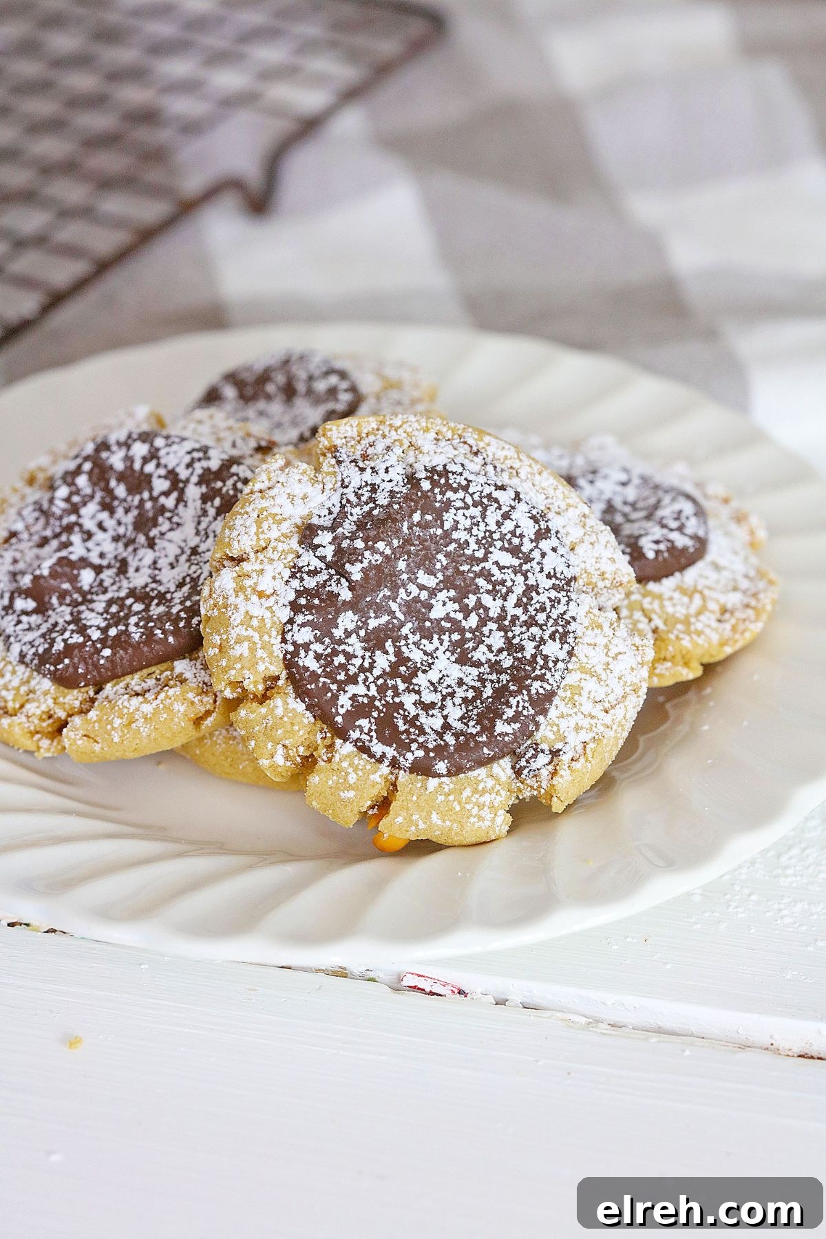 Muddy Buddy Cookies: Chocolate Peanut Butter Crunch 7 four muddy buddy cookies on a plate.