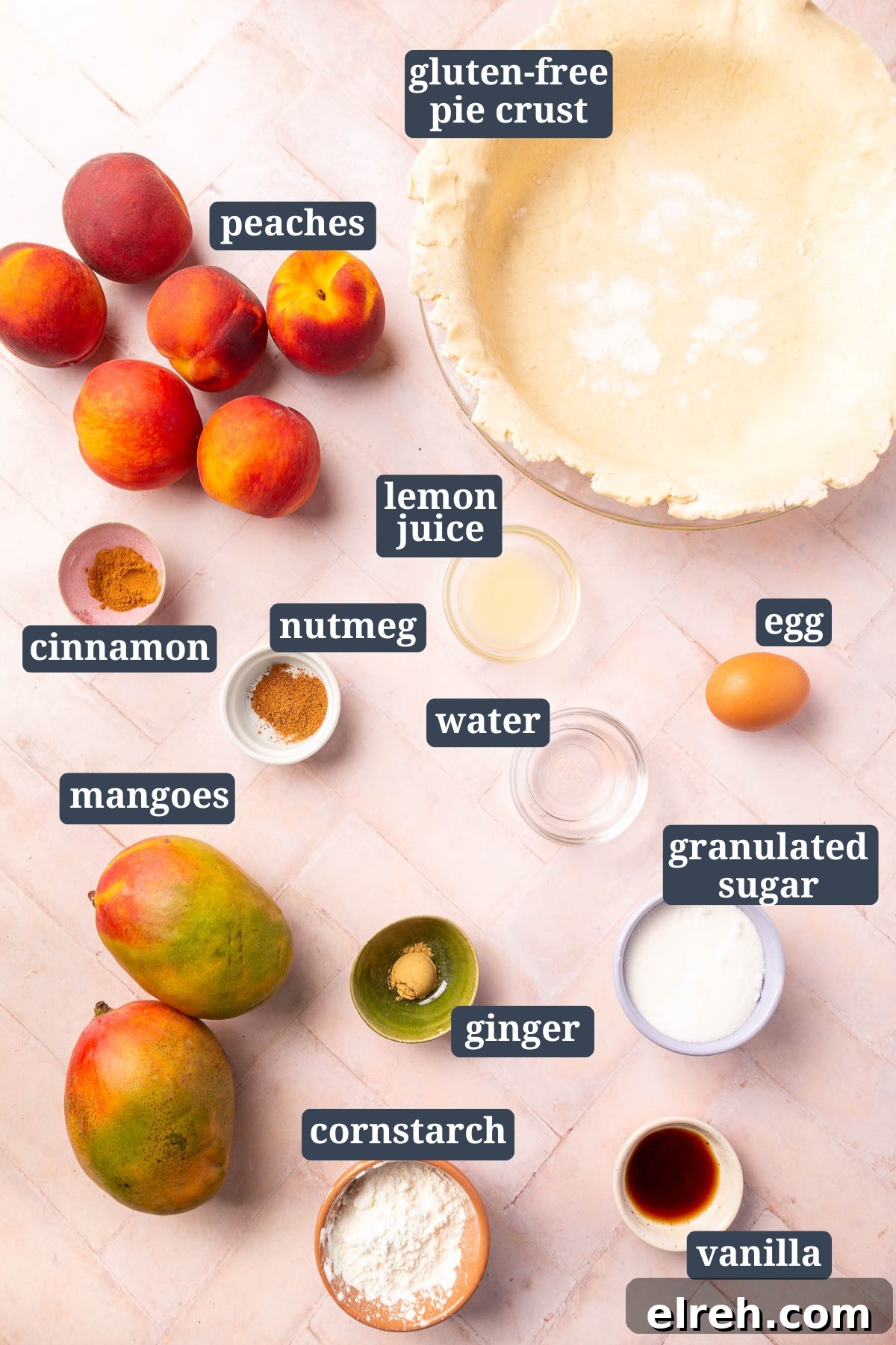 Gluten-Free Peach Mango Pie Recipe 3 An overhead view of ingredients for gluten-free peach mango pie, including peaches, gluten-free pie crust, lemon juice, cinnamon, nutmeg, water, egg, ginger, mangoes, granulated sugar, cornstarch, and vanilla.