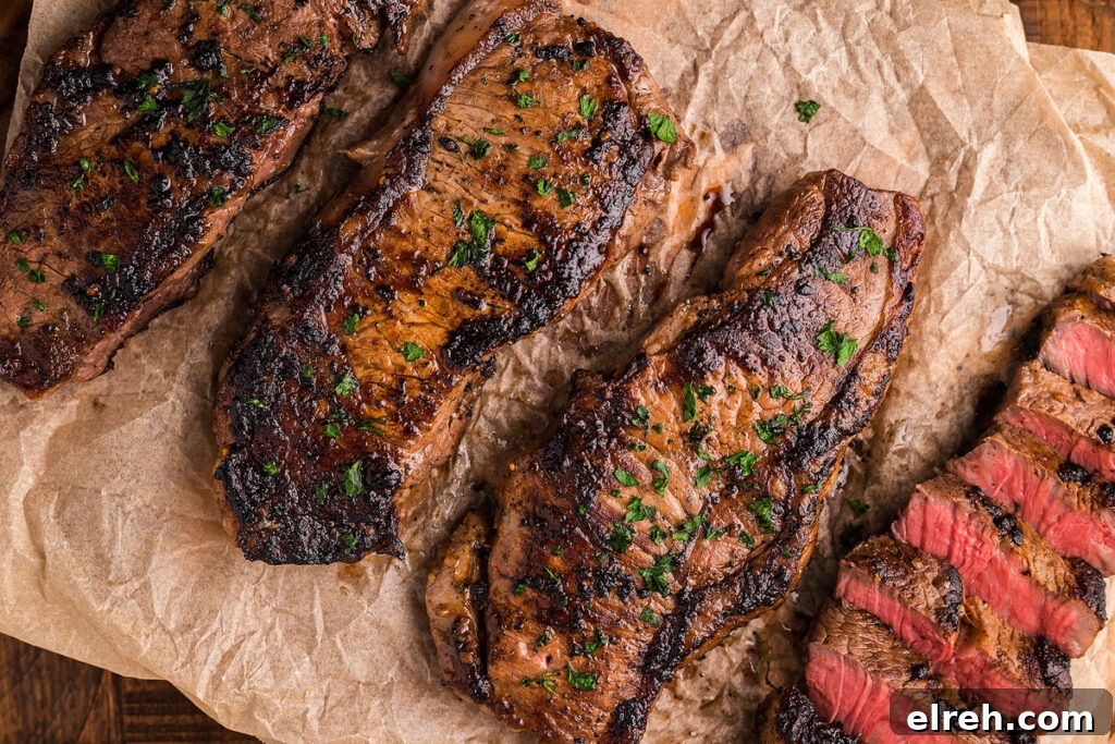 50 July Recipes to Cook This Summer 20 A strip steak sliced on a cutting board.