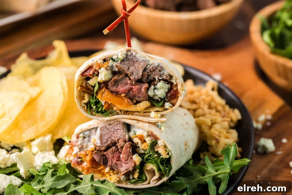 50 July Recipes to Cook This Summer 26 A steak wrap cut in half on a plate.