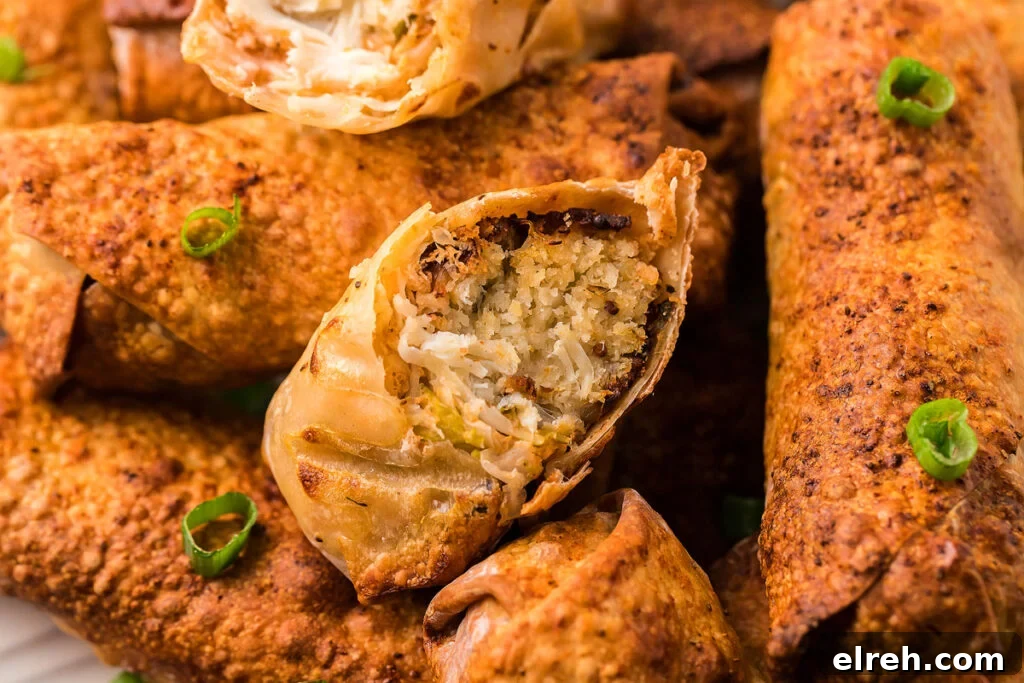 50 July Recipes to Cook This Summer 32 A plate of egg rolls and a bowl of dipping sauce.