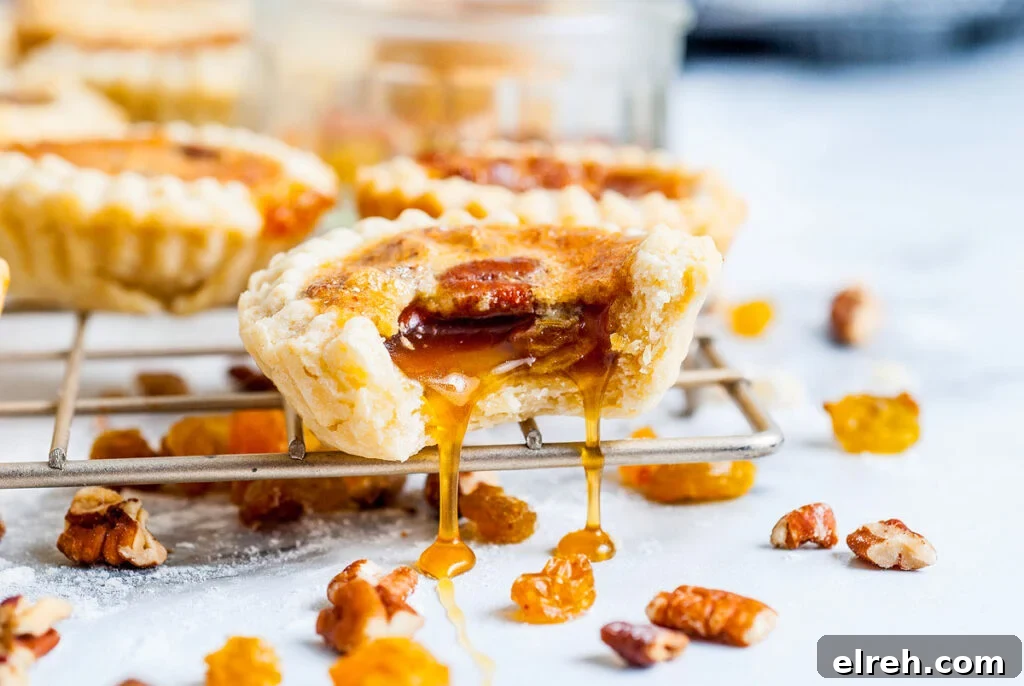 50 July Recipes to Cook This Summer 10 A gooey butter tart with a bite out of it on a wire rack.