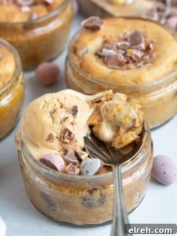 Air fryer mini egg dessert pots with a scoop of ice cream on top.
