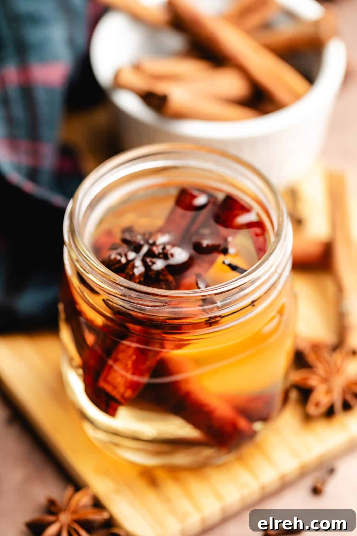 Spiced simple syrup on a wooden board.