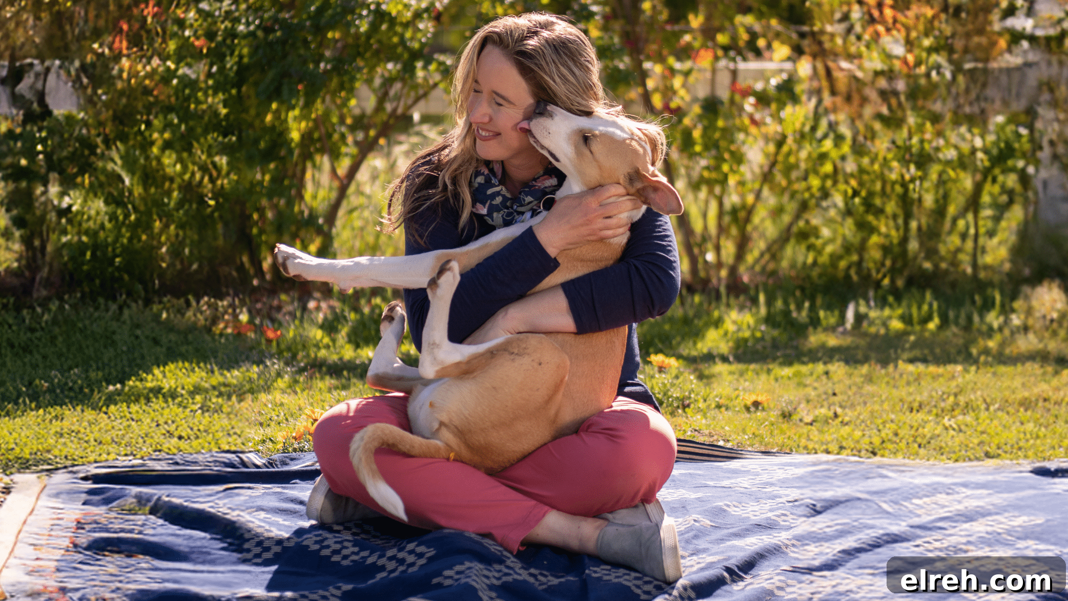 Dr. Bronner's Guide to Pet Care and Cleaning 2 Lisa and her dog Sadie on a picnic blanket.
