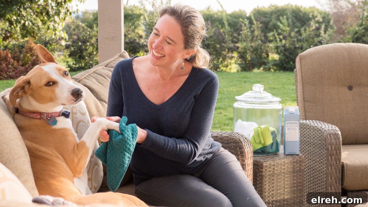 Dr. Bronner's Guide to Pet Care and Cleaning 9 Lisa wiping her dog's paws with GIY Pet Wipes.