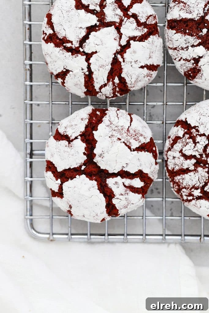 Chewy Gluten-Free Hot Chocolate Cookies Recipe 10 red velvet crinkles cooling on a wire rack
