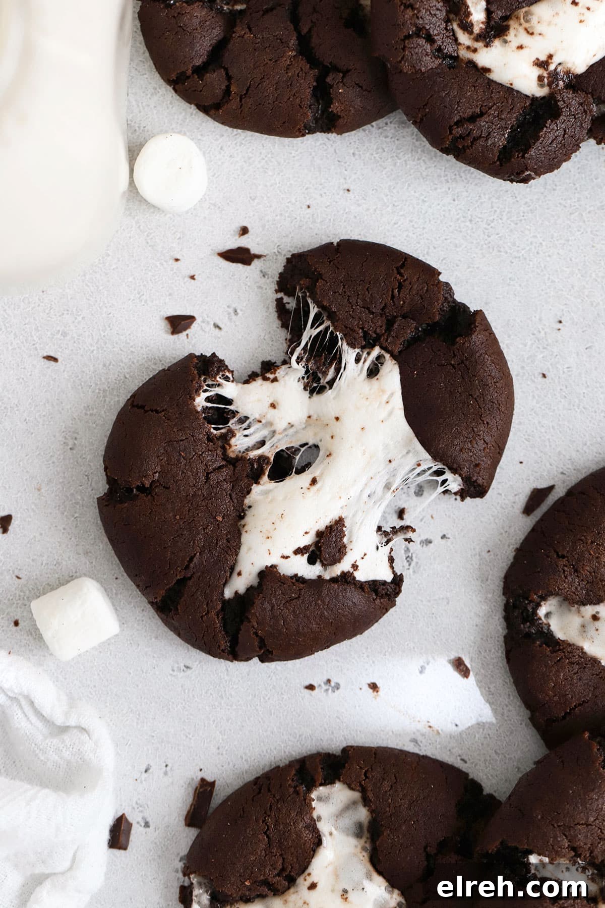 Chewy Gluten-Free Hot Chocolate Cookies Recipe 7 gluten-free hot chocolate cookie being pulled apart to show gooey marshmallow center