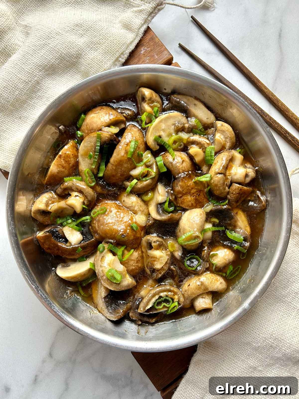 steamed mushrooms garnished with scallions