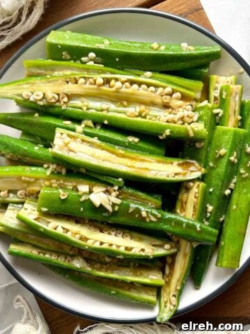 overhead shot of steamed okra on plate.