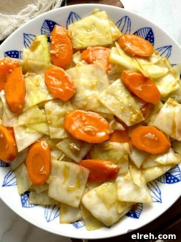 overhead shot of carrots and cabbage stir-fry on plate.