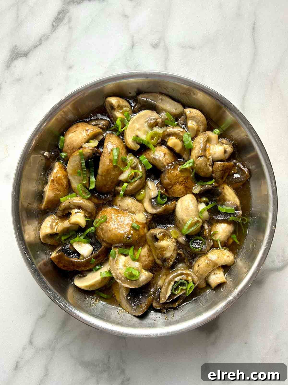 steamed mushrooms garnished with scallions