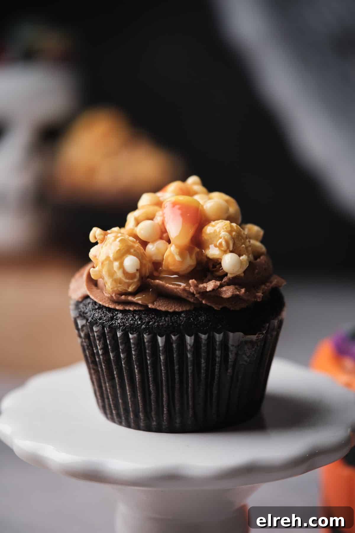 Chocolate Caramel filled cupcake topped with caramel corn.