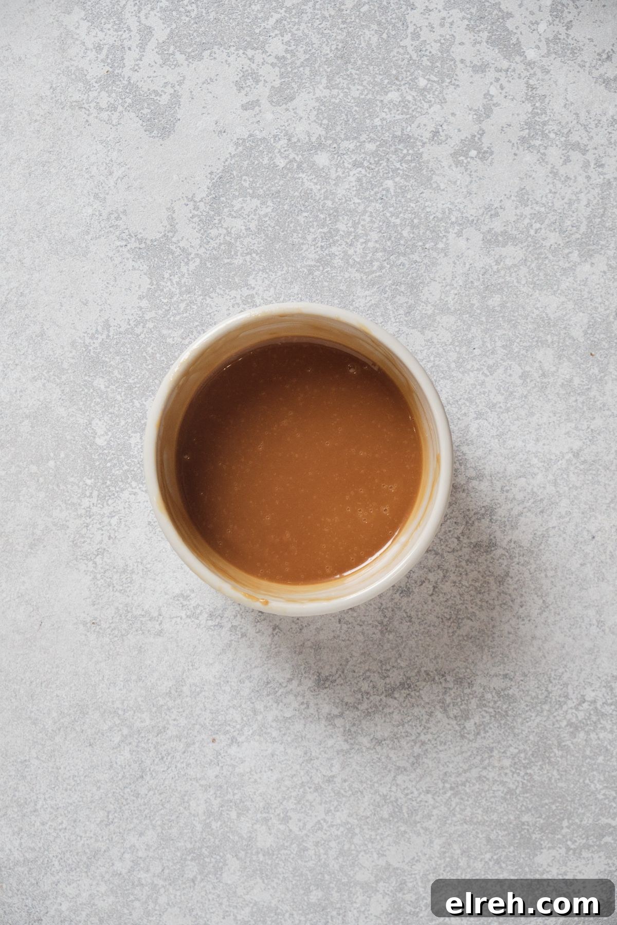 Caramel cupcake filling in a bowl.
