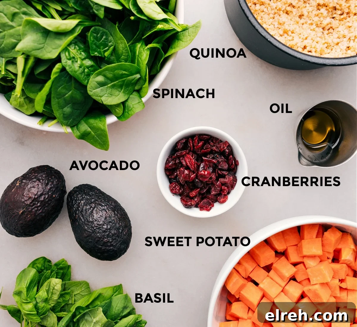 Ingredients In Sweet Potato Quinoa Salad All the ingredients—veggies, grains, cranberries, oil, and avocado—are prepped for easy assembly.